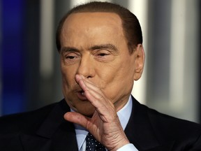 Italian former Prime Minister Silvio Berlusconi gestures during the recording of the Italian state television talk show in Rome, Thursday, Jan. 11, 2018.