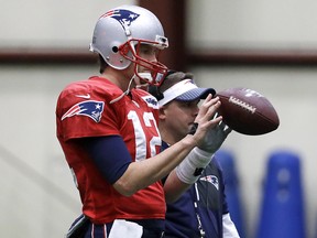 New England Patriots quarterback Tom Brady catches a ball during a practice Wednesday, Jan. 31, 2018, in Minneapolis. (AP Photo/Mark Humphrey)