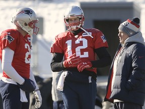 New England Patriots quarterbacks Brian Hoyer, left, and Tom Brady, centre, stand with head coach Bill Belichick during practice Thursday, Jan. 18, 2018, in Foxborough, Mass. (AP Photo/Steven Senne)