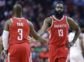 Houston Rockets guard James Harden shakes hands with Chris Paul on Dec. 16, 2017