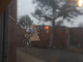 A bullet hole through a kitchen window at a home at the Ardwick Blvd. TCHC housing complex parking lot - where a recent shooting occurred  east of Islington Ave. and Finch Ave. W. (JACK BOLAND/TORONTO SUN)