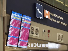 An arrivals and departures information screen is seen at the Halifax Stanfield International Airport in Halifax on Thursday, Jan. 4, 2018. Environment Canada has issued winter storm warnings and watches for Nova Scotia, New Brunswick, P.E.I. and parts of Newfoundland and Labrador, saying the low-pressure system east of Cape Hatteras will bring fierce winds and heavy snow. THE CANADIAN PRESS/Andrew Vaughan