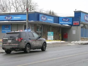 Brantford Police at the scene of a homicide outside a Rexall pharmacy.