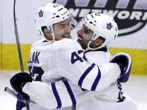 Toronto Maple Leafs center Nazem Kadri, right, celebrates with center Tyler Bozak after scoring his goal against the Chicago Blackhawks during the third period of an NHL hockey game Wednesday, Jan. 24, 2018, in Chicago. The Toronto Maple Leafs defeated the Chicago Blackhawks 3-2 in overtime. (AP Photo/Nam Y. Huh)