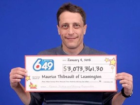 Maurice Thibeault receives half his Lotto 6/49 jackpot win in Toronto on Thursday, Jan. 4, 2018. (OLG photo)
