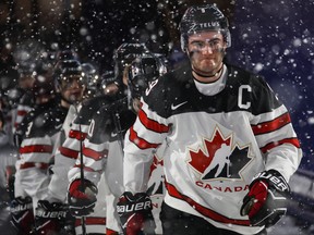 Canada's Dillon Dube leads his team to the ice for third period IIHF World Junior Championship preliminary outdoor game action against the United States, at New Era Field in Orchard Park, N.Y., Friday, December 29, 2017. THE CANADIAN PRESS/Mark