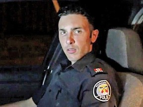 Toronto Police Const. Vittorio Dominelli appears with a fellow officer in a Bollywood-style video posted online.
