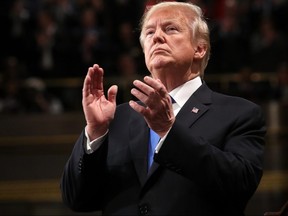 U.S. President Donald J. Trump claps during the State of the Union address in the chamber of the U.S. House of Representatives in Washington, D.C., on Tuesday, Jan. 30, 2018.