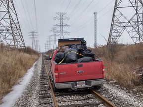 A truck OPP say was stolen is pictured on train tracks in Hamilton on Monday, Jan. 22, 2018. (OPP_HSD)