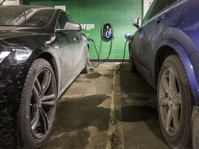 Two electric vehicles using the GE WattStation at the parking lot under the Manulife Centre in Toronto, Ont. on Thursday January 18, 2018. Ernest Doroszuk/Toronto Sun/Postmedia Network