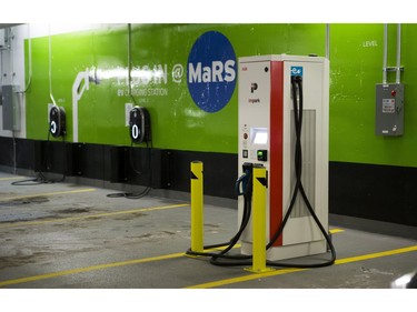 GE WattStations (wall mounted) and Electric Vehicle Chargers Ontario (EVCO), white free standing unit,  at the parking lot under the MaRS Centre in Toronto, Ont. on Thursday January 18, 2018.