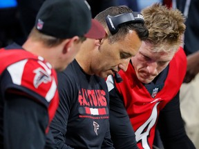 Offensive coordinator Steve Sarkisian converses with Matt Simms and Matt Ryan against the Jacksonville Jaguars at Mercedes-Benz Stadium on Aug. 31, 2017