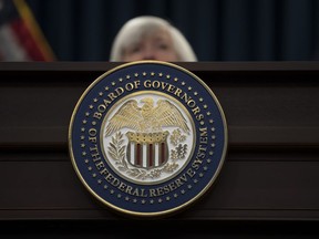 The seal of the Board of Governors of the United States Federal Reserve System is displayed on the desk as Federal Reserve Chair Janet Yellen speaks during a news conference following the Federal Open Market Committee meeting in Washington, Wednesday, Dec. 13, 2017. (AP Photo/Carolyn Kaster)