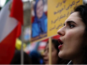 Demonstrators of the National Council of Resistance of Iran protest near the Iran's embassy in Paris, Saturday, Jan. 6, 2018, in solidarity with those demonstrating in Iran. Iran has seen its largest anti-government protests since the disputed presidential election in 2009, with thousands taking to the streets in several cities in recent days.