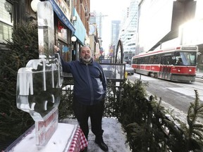 Al Carbone, owner of the Kit Kat restaurant on King St. W., erected an ice sculpture to protest the King St. Pilot Project. ( Jack Boland/Toronto Sun/Postmedia Network
