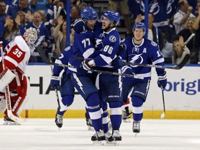 Nikita Kucherov #86 of the Tampa Bay Lightning celebrates his goal with teammate Victor Hedman.  Both Bolts were mid-season award winners in a poll of hockey writers.
 (Photo by Mike Carlson/Getty Images)