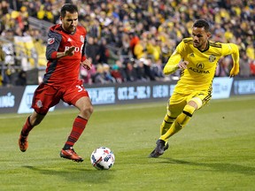 Steven Beitashour #33 of the Toronto FC and Artur #7 of the Columbus Crew SC chase after the ball during the second half at MAPFRE Stadium on November 21, 2017 in Columbus, Ohio. Columbus tied Toronto 0-0. (Photo by Kirk Irwin/Getty Images)