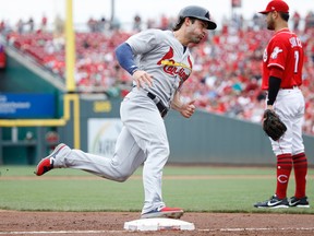 Randal Grichuk of the St. Louis Cardinals runs around third base during a game against the Cincinnati Reds at Great American Ball Park on Aug. 6, 2017