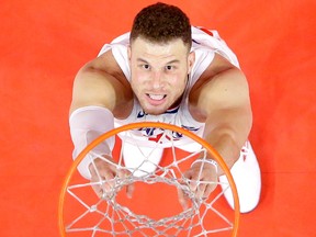 L.A. Clippers forward Blake Griffin hangs on the net during an NBA game against the Minnesota Timberwolves on Jan. 22, 2018