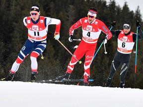 (L-R) Didrik Toenseth of Norway, Alex Harvey of Canada, Dario Cologna of Switzerland compete in the Mens FIS Cross Country 15 km Mass Start World Cup on January 28, 2018 in Seefeld, Austria. (BARBARA GINDL/AFP/Getty Images)