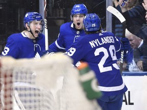 Toronto Maple Leafs centre Auston Matthews (34) celebrates his goal with defenceman Travis Dermott (23) and centre William Nylander (29) scoring moments after a disallowed goal during second period NHL hockey action against the Colorado Avalanche in Toronto on Monday, January 22, 2018. THE CANADIAN PRESS/Nathan Denette
