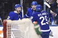 Toronto Maple Leafs centre Auston Matthews (34) celebrates his goal with defenceman Travis Dermott (23) and centre William Nylander (29) scoring moments after a disallowed goal during second period NHL hockey action against the Colorado Avalanche in Toronto on Monday, January 22, 2018. THE CANADIAN PRESS/Nathan Denette