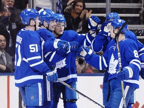 Toronto Maple Leafs' Jake Gardiner, left to right, Auston Matthews, William Nylander, Zach Hyman and Connor Carrick celebrate Matthews' goal against the San Jose Sharks during first period NHL hockey action, in Toronto on Thursday, January 4, 2018. THE CANADIAN PRESS/Frank Gunn