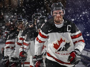 Canadian captain Dillon Dube leads his team onto the ice for the third period of their world junior outdoor game against the U.S. in Buffalo on Dec. 29.