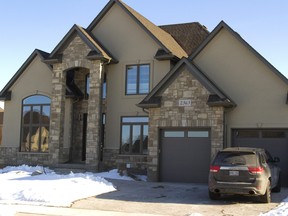 This London, Ont. residence was raided by police as part of investigation into a massive gambling ring associated with the Platinum Sports Book gambling website that was raided in February in Markham. MIKE HENSEN/POSTMEDIA NETWORK)