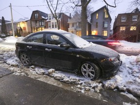 Rosedale resident Anna Buchanan says her daughter's Mazda 3 has been blocked and tires frozen to the ground in for the past six days because of a water main break on their street, Glen Rd., in Rosedale.