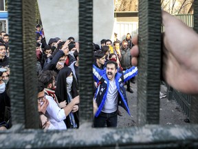As widespread protests in Iran reached their sixth day, Iranian-Canadians are voicing concern for their loved ones and calling on Canada to show greater solidarity with peaceful demonstrators. In this Saturday, Dec. 30, 2017 photo, by an individual not employed by the Associated Press and obtained by the AP outside Iran, university students attend an anti-government protest inside Tehran University, in Tehran, Iran. THE CANADIAN PRESS/AP