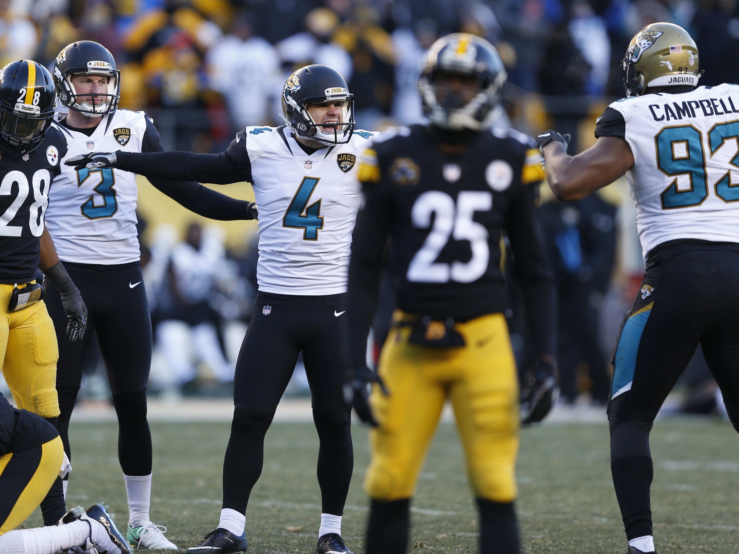 Jacksonville Jaguars kicker Josh Lambo (4) celebrates with Calais Campbell  (93) after kicking a field goal during the second half of an NFL divisional  football AFC playoff game against the Pittsbu …