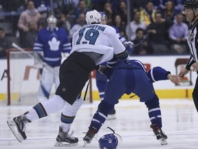 San Jose Sharks Joe Thornton hammers Nazem Kadri of the Toronto Maple Leafs after dropping the gloves two seconds into the first period in Toronto on Jan. 4, 2018. (JACK BOLAND//Toronto Sun)
