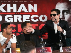 Phil Lo Greco gestures towards Amir Khan during an Amir Khan and Phil Lo Greco press conference at the Hilton Hotel on Jan. 30, 2018 in Liverpool, England