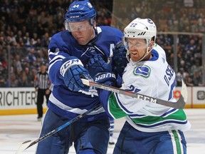 Daniel Sedin of the Vancouver Canucks skates against Morgan Rielly of the Toronto Maple Leafs during an NHL game at the Air Canada Centre on Jan. 6, 2018