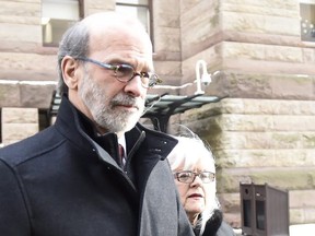 David Livingston leaves court with supporters in Toronto, Friday, Jan.19, 2018. Livingston, a former top political aide in Ontario, has been found guilty of illegally destroying documents related to a controversial government decision to cancel two gas plants before a provincial election.