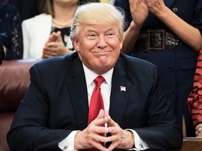 US President Donald Trump smiles during a national teacher of the year event in the Oval Office of the White House April 26, 2017 in Washington, DC. / AFP PHOTO / Brendan SmialowskiBRENDAN SMIALOWSKI/AFP/Getty Images