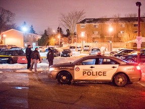 Toronto Police at an apartment building parking lot at 58 Waterton Road, near Scarlet Road and Lawrence Avenue, in Etobicoke, after a man was shot dead Tuesday, Jan. 9, 2018. (Victor Biro photo)