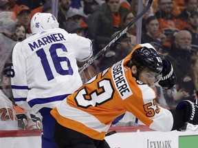 Philadelphia Flyers' Shayne Gostisbehere, right, collides with Toronto Maple Leafs' Mitchell Marner during the first period of an NHL hockey game, Thursday, Jan. 18, 2018, in Philadelphia. (AP Photo/Matt Slocum)