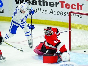 Mitch Marner slips the puck past Ottawa Senators' goaltender Craig Anderson to tie up Saturday nights game 3-3 in the third period. Adrian Wyld/Canadian Press