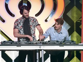 Alex Pall, left, and Andrew Taggart from The Chainsmokers, perform at Z100's iHeartRadio Jingle Ball in New York.