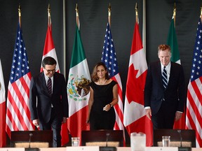 Minister of Foreign Affairs Chrystia Freeland meets for a trilateral meeting with Mexico's Secretary of Economy Ildefonso Guajardo Villarreal, left, and Ambassador Robert E. Lighthizer, United States Trade Representative, during the final day of the third round of NAFTA negotiations at Global Affairs Canada in Ottawa on Wednesday, Sept. 27, 2017. (THE CANADIAN PRESS/Sean Kilpatrick)