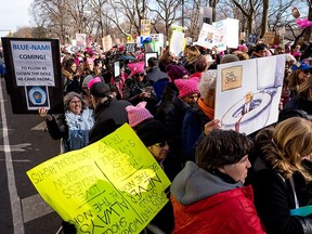 People line up on Central Park West as they wait for the start of a march highlighting equal rights and equality for women Saturday, Jan. 20, 2018, in New York. (AP Photo/Craig Ruttle)