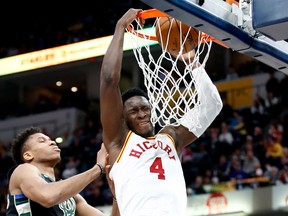 Victor Oladipo of the Indiana Pacers dunks the ball against the Milwaukee Bucks during the game at Bankers Life Fieldhouse on Jan. 8, 2018