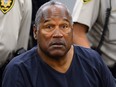 In this May 14, 2013 pool file photo, O.J. Simpson sits during a break on the second day of an evidentiary hearing in Clark County District Court in Las Vegas. (AP Photo/Ethan Miller, Pool, File)