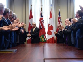 Ontario PC party interim leader Vic Fedeli is congratulated after a caucus meeting at Queen's Park in Toronto on Friday, January 26, 2018. Fedeli has been named interim leader of Ontario's Progressive Conservatives after Patrick Brown's resignation in the face of sexual misconduct allegations.
