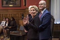 Ontario Premier Kathleen Wynne hams for the cameras as she stands next to newly appointed Minister of Economic Development and Growth, Steven Del Duca, during a swearing-in ceremony following a Cabinet Shuffle at the Ontario Legislature in Toronto on Wednesday, January 17, 2018. THE CANADIAN PRESS/Chris Young