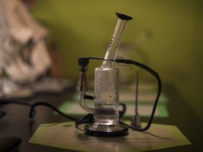 A bong stands on a counter at the Hotbox Cafe in Toronto on Saturday, January 20, 2018.  THE CANADIAN PRESS/Chris Young