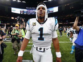 In this Dec. 3, 2017 file photo, Carolina Panthers quarterback Cam Newton (1) walks on the field after an NFL football game against the New Orleans Saints in New Orleans.   The NFL and the Players Association announced the Panthers correctly followed concussion protocol guidelines when handling Newtons injury during a first-round playoff loss to the Saints. The league released a statement Wednesday, Jan. 24, 2018,  saying it reviewed game footage and medical reports, as well as statements and interviews with Newton and coach Ron Rivera, before making its determination that there was no protocol violation.