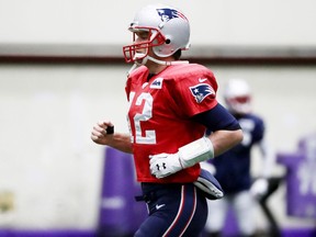 Tom Brady of the New England Patriots warms up during the New England Patriots practice on Jan. 31, 2018 at Winter Park in Eden Prairie, Minnesota